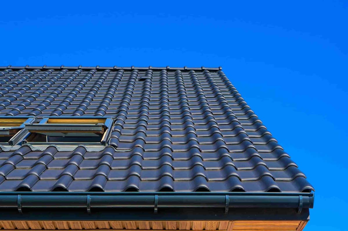 Close-up of a well-maintained roof with new shingles, representing roofing expertise